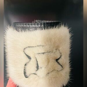 Leather and fur cuff bracelet. Snap closure.